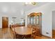 Dining area with hardwood floors, seamlessly connected to the living room and kitchen at 5960 Glencoe St, Commerce City, CO 80022