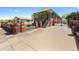 Brick home with a gated driveway and mature landscaping, offering curb appeal at 5960 Glencoe St, Commerce City, CO 80022