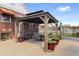 Charming backyard patio with a gazebo, seating area, and potted plants, perfect for outdoor living at 5960 Glencoe St, Commerce City, CO 80022