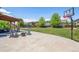 Large backyard with patio, pergola, fire pit and basketball court at 8939 Devinney Ct, Arvada, CO 80005