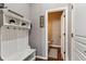 Convenient bathroom with a toilet and tiled floor at 8939 Devinney Ct, Arvada, CO 80005