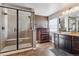 Elegant bathroom with a large walk-in shower and double vanity at 8939 Devinney Ct, Arvada, CO 80005