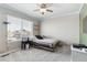 Bedroom with a pallet bed, large window, and ceiling lights at 8939 Devinney Ct, Arvada, CO 80005