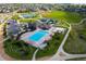 Aerial view of community pool, playground, and tennis courts at 8939 Devinney Ct, Arvada, CO 80005