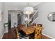 Bright dining room with hardwood floors and a large chandelier at 8939 Devinney Ct, Arvada, CO 80005