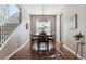 Formal dining room with hardwood floors, chandelier, and adjacent to the kitchen at 8939 Devinney Ct, Arvada, CO 80005