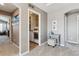 Convenient laundry room with washer, dryer, and storage shelves at 8939 Devinney Ct, Arvada, CO 80005