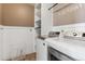 Laundry room with washer, dryer, and lots of shelving at 8939 Devinney Ct, Arvada, CO 80005