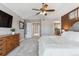 Main bedroom with a king-size bed and access to the bathroom at 8939 Devinney Ct, Arvada, CO 80005