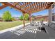 Covered patio with pergola, comfortable seating at 8939 Devinney Ct, Arvada, CO 80005