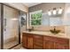 Updated bathroom featuring a glass enclosed shower and vanity with dual vessel sinks at 1352 N Downing St, Denver, CO 80218