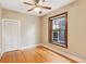 Cozy bedroom featuring hardwood floors, a ceiling fan, closet, and a window overlooking the neighborhood at 1352 N Downing St, Denver, CO 80218