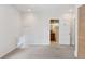 Carpeted bedroom featuring a glimpse into an adjacent bathroom and a closet with paneled doors at 1352 N Downing St, Denver, CO 80218