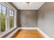 Minimalist bedroom featuring hardwood floors, neutral walls, and large windows with natural lighting at 1352 N Downing St, Denver, CO 80218