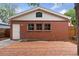 Exterior view of the brick garage with a wood deck in front at 1352 N Downing St, Denver, CO 80218