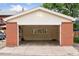 Open garage with exposed shelving, windows, and a back door for convenience at 1352 N Downing St, Denver, CO 80218