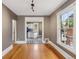 Inviting living room showcasing neutral walls, hardwood floors, and a clear view into the adjacent kitchen at 1352 N Downing St, Denver, CO 80218