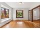 Bright living room featuring hardwood floors, large windows, and classic architectural details at 1352 N Downing St, Denver, CO 80218