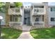 Two-story condominium featuring balconies and stone accents on the exterior at 13333 E Asbury Dr # 104, Aurora, CO 80014