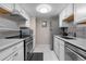 Well-lit kitchen featuring stainless steel appliances, granite countertops and a gray tile backsplash at 13333 E Asbury Dr # 104, Aurora, CO 80014