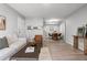 Open-concept living room with a dining area, featuring a neutral color palette and modern furnishings at 13333 E Asbury Dr # 104, Aurora, CO 80014
