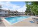 Community pool surrounded by lounge chairs, offering a relaxing outdoor space at 13333 E Asbury Dr # 104, Aurora, CO 80014