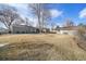 Spacious backyard with detached garage and large grassy area at 5450 Flower Ct, Arvada, CO 80002