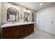 Modern bathroom with double vanity and stylish mirrors at 5450 Flower Ct, Arvada, CO 80002