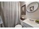 Clean bathroom with a shower/tub combo and neutral decor at 5450 Flower Ct, Arvada, CO 80002