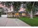 Attractive curb appeal with a large tree and well-manicured lawn at 5450 Flower Ct, Arvada, CO 80002