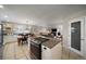 Eat-in kitchen with granite island, white cabinets, and a farmhouse table at 5450 Flower Ct, Arvada, CO 80002