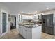 Modern kitchen with stainless steel appliances and a large island at 5450 Flower Ct, Arvada, CO 80002