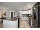 Modern kitchen features granite countertops, white cabinets, and stainless steel appliances at 5450 Flower Ct, Arvada, CO 80002