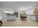 Spacious kitchen with white cabinets, granite countertops, and an island at 5450 Flower Ct, Arvada, CO 80002