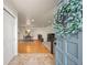 Inviting entryway with tile floors, coat closet, and open view to the dining room at 2609 S Quebec St # 9, Denver, CO 80231