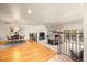 Open concept living space featuring dining area, living room with fireplace, and vaulted ceilings at 2609 S Quebec St # 9, Denver, CO 80231
