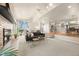 Bright living room boasts large windows, fireplace, and open floor plan to dining area at 2609 S Quebec St # 9, Denver, CO 80231