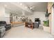 Cozy living room with fireplace, neutral carpet, and open staircase to dining area at 2609 S Quebec St # 9, Denver, CO 80231