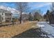 Large backyard with a wood fence that backs up to other houses at 6530 S Walden St, Aurora, CO 80016