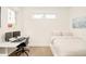 Bright bedroom featuring hardwood floors, a minimalist aesthetic, desk space, and abundant natural light at 1945 W 34Th Ave, Denver, CO 80211