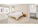 Bright bedroom with large windows, a neutral color palette, and an attached vanity at 1945 W 34Th Ave, Denver, CO 80211