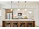 Stylish kitchen with stainless steel appliances, granite countertops, and a breakfast bar with seating at 1945 W 34Th Ave, Denver, CO 80211