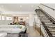 Open-concept living area showcasing modern design with staircase, dining, and kitchen, perfect for entertaining at 1945 W 34Th Ave, Denver, CO 80211