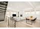 Bright and airy living room features an open floor plan, modern fireplace and staircase with metal railings at 1945 W 34Th Ave, Denver, CO 80211