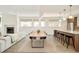 Spacious and bright living room open to dining area and kitchen, featuring sleek modern finishes at 1945 W 34Th Ave, Denver, CO 80211