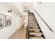 Bright, modern staircase with open design, hardwood floors and lots of natural light at 1945 W 34Th Ave, Denver, CO 80211