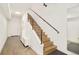 Modern staircase with wooden steps and metal railings leads to the upper level of the home at 1945 W 34Th Ave, Denver, CO 80211