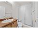 Bathroom includes a shower/tub combo and wood vanity at 958 Bramblewood Dr, Castle Pines, CO 80108