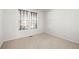 Well-lit bedroom with neutral walls and carpet flooring at 958 Bramblewood Dr, Castle Pines, CO 80108