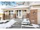 Two-story house with brick accents and a covered entryway at 958 Bramblewood Dr, Castle Pines, CO 80108